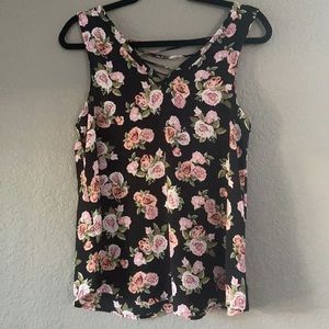 Sheer flowered top 97% polyester/3% spandex.